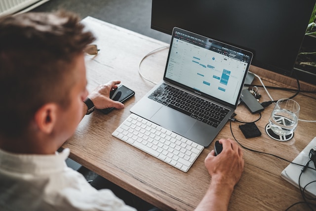 Man checking his calendar on a computer